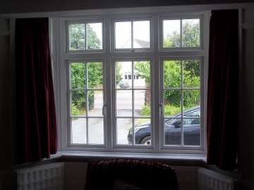 NORTHWICH CHESHIRE - Internal view of an Installtion of Evolution "STORM 2 " white wood PvcU windows , complete with Astragal bar glass design and dummy sash look to give the glass the same size panes. 